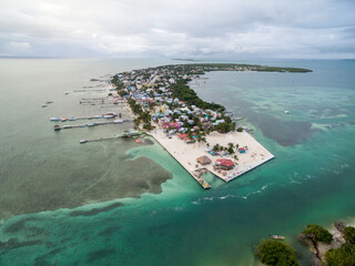 Caye Caulker island in Belize. Cloudy Morning Sky and Caribbean Sea in Background.