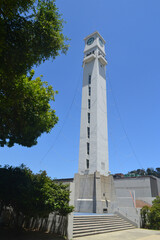 Obraz premium the clock tower at the university of concepcion in chile with some beautiful gardens