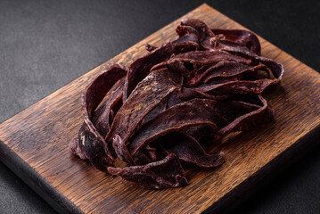 Delicious salted dried beef cut into slices as an appetizer for beer