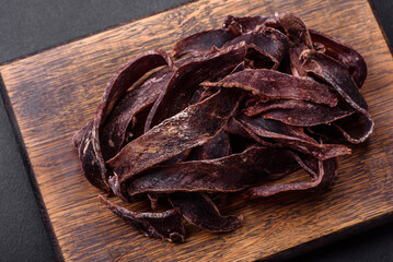 Delicious salted dried beef cut into slices as an appetizer for beer
