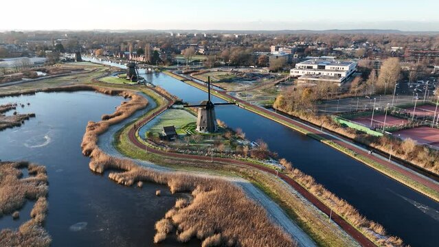 Strijkmolen E, Ouddorp, Alkmaar, North Holland,The Netherlands. Oak octagonal polder mill from 1630. Ironing mills do not drain polders, grind the water from one reservoir to the other. Winter aerial.