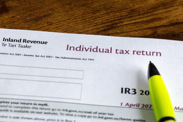 New Zealand individual tax return, IR3 print and pen lying on the desk