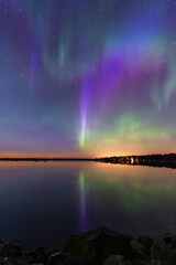 Northern lights reflected in the sea. Nykarleby/Uusikaarlepyy. Finland