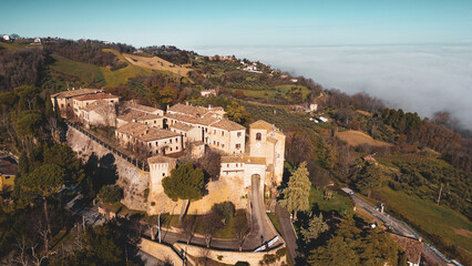 Fototapeta premium Italy, December 2022: aerial view of the beautiful medieval village of Montegridolfo in the province of Rimini in the Emilia Romagna region bordering the Marche region