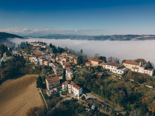 Fototapeta premium Italy, December 2022: aerial view of the beautiful medieval village of Colbordolo in the province of Pesaro in the Marche region