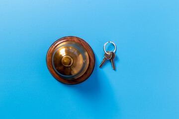 Hotel service bell with keys. Booking and checkin concept