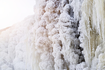 Frozen small mountain waterfall close up. Frozen Jagala Falls, Estonia. small river waterfall frozen in winter.