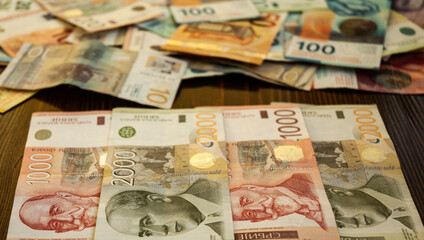 Fototapeta na wymiar Group of Serbian Dinar banknote, Behind are Swiss franc and Euro.