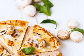 Tasty fresh baked pizza with champignons and chicken fillet