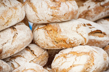 Fresh wholegrain loaves of rye or wheat bread