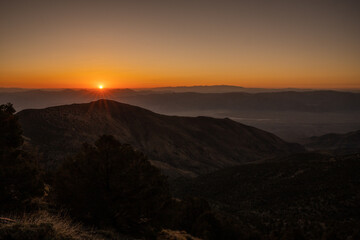 Orange Sunburst Rises Over the Death Valley Mountains