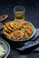 Potato pancakes in a bowl. Draniki.