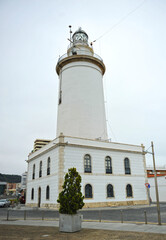 La Farola famoso faro a la entrada del puerto de Málaga, capital de la Costa del Sol, España 