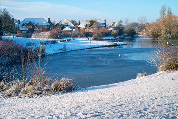Leftover snow in a beautiful neighbourhood of Furzton Lake on sunny morning in December 4