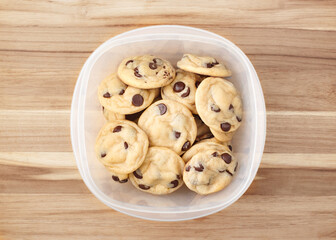 Homemade chocolate chip cookies in plastic food container