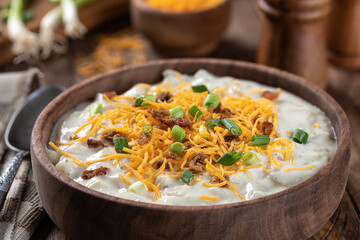Cream of potato soup with bacon, cheese and green onions