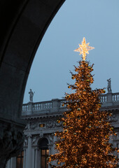 Christmas tree in the St. Mark's square in Venice, Italy, view from the Doge's palace portico