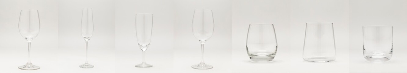 a set of glass wine glasses and glasses for drinks and alcohol on a white background