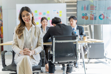 A group of young Asian businessmen Talking and planning work happily and have fun. at the company's office