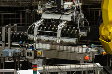 Obraz premium Production of cremant sparkling wine in Burgundy, France. Automatically powered bottling lines on factory.