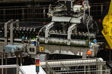 Production of cremant sparkling wine in Burgundy, France. Automatically powered bottling lines on factory.