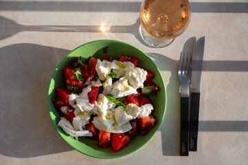 Itaian vegetarian food, fresh caprese salad made with white soft italian mozzarella cheese, red tomato and green basil