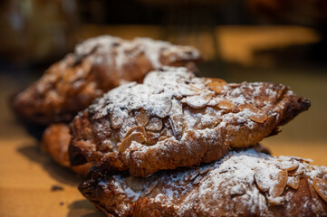 French sweet dessert pastry with almonds on display in french bakery