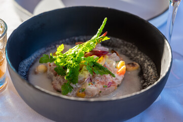 Tartare of seabass with mango, passion fruit and coconut milk
