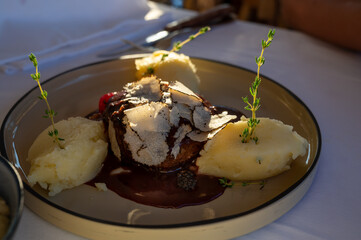 Beefsteak served with fresh black truffle mushroom and balls of mashed potato in French restaurant