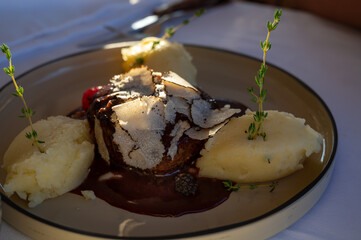 Beefsteak served with fresh black truffle mushroom and balls of mashed potato in French restaurant