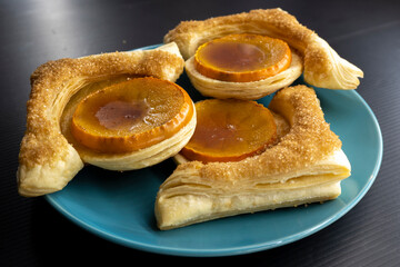 puff pastry with persimmon. food concept. bakery products