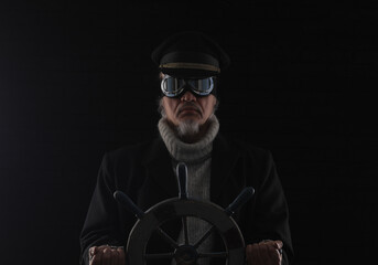 ship captain at the steering wheel