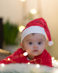 baby in santa claus hat