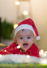 baby in santa hat smiling