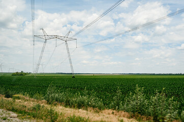 Fototapeta na wymiar High -voltage lines in the Ukrainian fields at the beginning of the war.