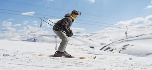 Profile shot of a man skiing on a sunny day