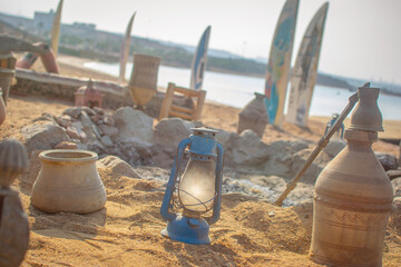 Traditional Authentic Colorful Bedouin Camp on the beach  with coffee pots and fire place, jars,...