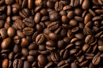 Roasted coffee beans background. Healthy beverage ingredients