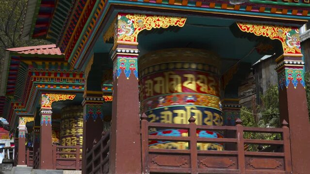 Prayer drums are an integral part of the Buddhist landscape. Prayer drums are rotated by stream in Namche Bazaar.