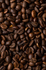 Roasted coffee beans background. Healthy beverage ingredients