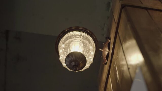 Antique mood lights hanging on the wall of the cafe.
