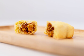 selective focused close-up Pineapple cheese pie. delicious traditional Taiwanese pastry containing butter, flour, egg, sugar, cream cheese, and pineapple jam.