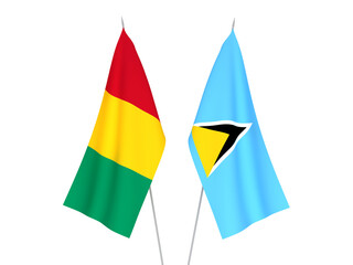 National fabric flags of Guinea and Saint Lucia isolated on white background. 3d rendering illustration.