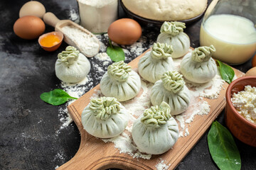 Georgian dumplings Khinkali with cheese and spinach. Raw semi-finished products dumplings. banner, menu, recipe place for text, top view