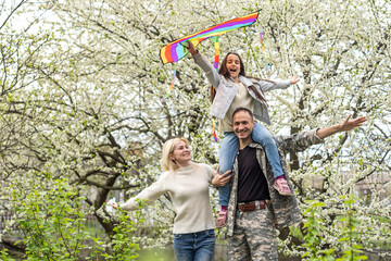 Family Welcoming Husband Home On Army Leave.