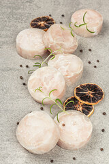 Chunks of frozen hake. Marine fish fillet on stone background, raw ingredient for cooking food
