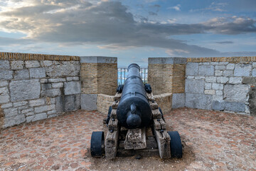 Fototapeta na wymiar Military Heritage Centre of Gibraltar. Old historical cannon battery at the top of The Rock of Gibraltar. No people, beautiful sunshine, amazing blue sky above. UK 
