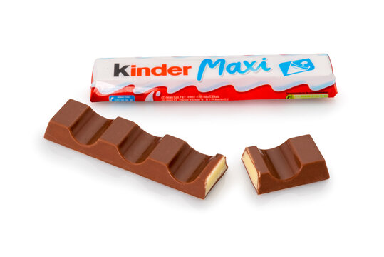 Alba, Italy - December 28, 2022: Kinder Maxi Ferrero isolated on white, package and cut out chocolate bar with milk cream filling view. Ferrero is a confectionary company famous all over the world