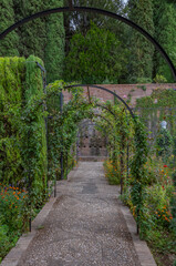 Alhambra de Granada. Palace and fortress of Granada. Ramparts, interiors, buildings, towers, courtyards of a medieval fortress in the Arab, Moorish style.                                              