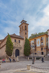 Granada, Spain, 21st of October, 2022. On the way to the Alhambra  Palace. Carrera Del Darro street with small souvenir shops and walking tourists. Narrow cobbled street of Granada in sunshine.       